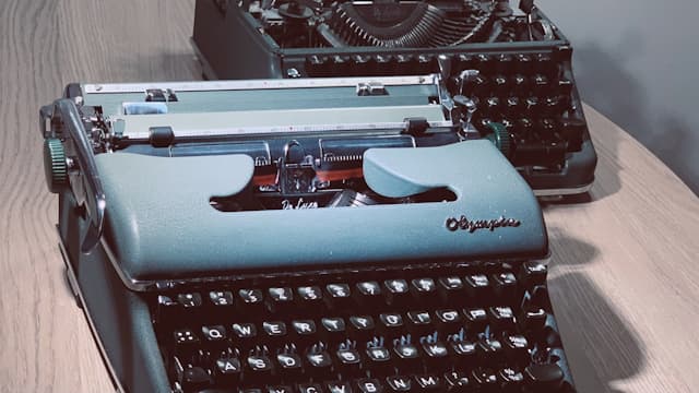 Photo of two typewriters.